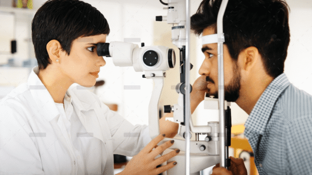 demo-attachment-1398-optometrist-examining-patient-in-modern-RXUVD5T