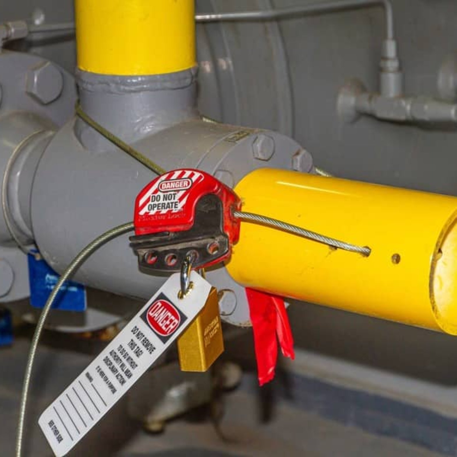 Construction worker applying lockout/tagout on electrical panel