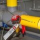 Construction worker applying lockout/tagout on electrical panel