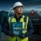 Safety officer reviewing the DOT Emergency Response Guidebook at a hazardous materials transport site