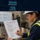 Hot work awareness practice test featured image showing a female industrial safety trainer reviewing a quiz document at a worktable with a face shield and gloves, and a 2x2 stat grid in the top bar showing 35ft radius, 30-minute watch, air check limit, and 10-question test.